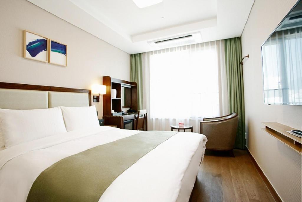 Postel nebo postele na pokoji v ubytování Stanford Hotel Busan