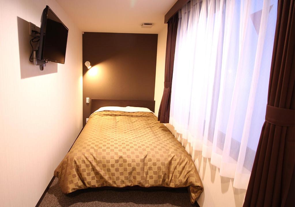Postel nebo postele na pokoji v ubytování Hotel Trend Asakusa Annex
