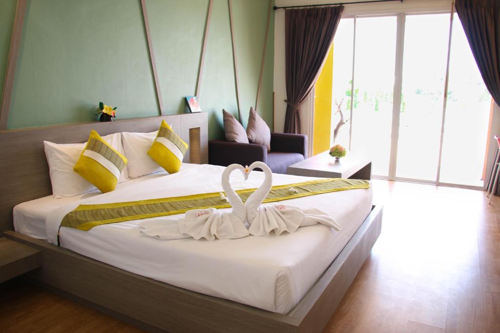 Postel nebo postele na pokoji v ubytování Aurora Resort Khao Yai