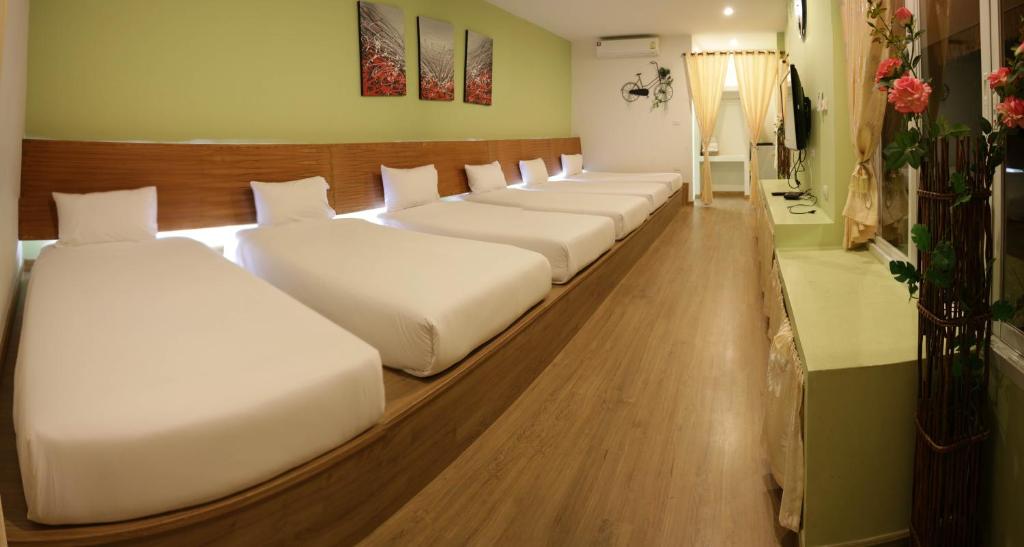 Postel nebo postele na pokoji v ubytování Aurora Resort Khao Yai