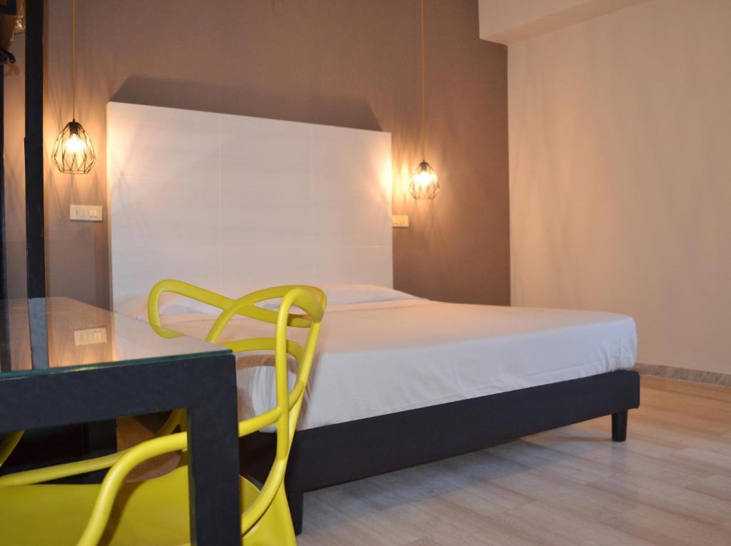 Postel nebo postele na pokoji v ubytování ibis styles Trani