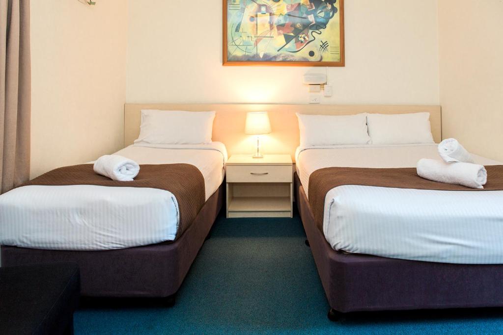 Postel nebo postele na pokoji v ubytování Bentleigh Motor Inn