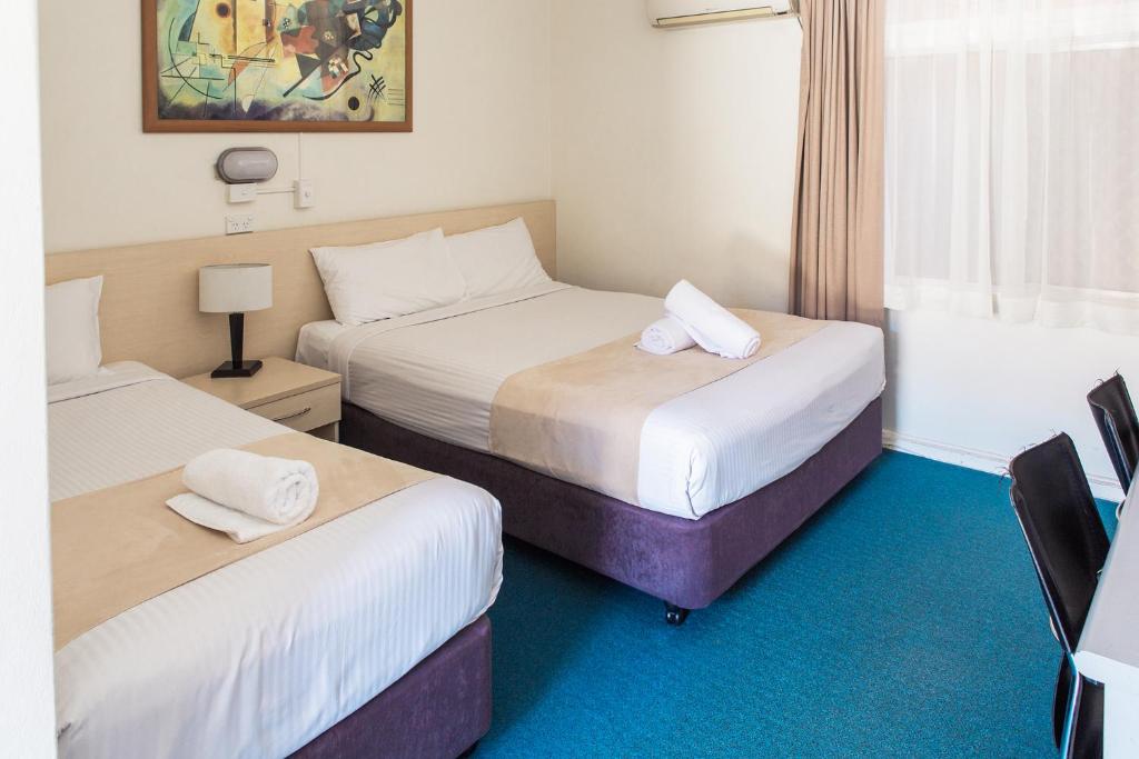 Postel nebo postele na pokoji v ubytování Bentleigh Motor Inn