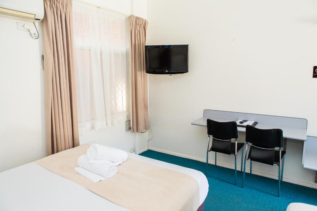 Postel nebo postele na pokoji v ubytování Bentleigh Motor Inn