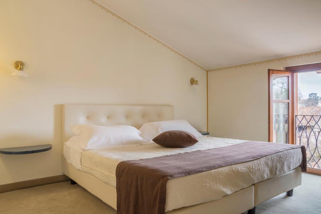 Postel nebo postele na pokoji v ubytování Hotel Ponte di Rialto