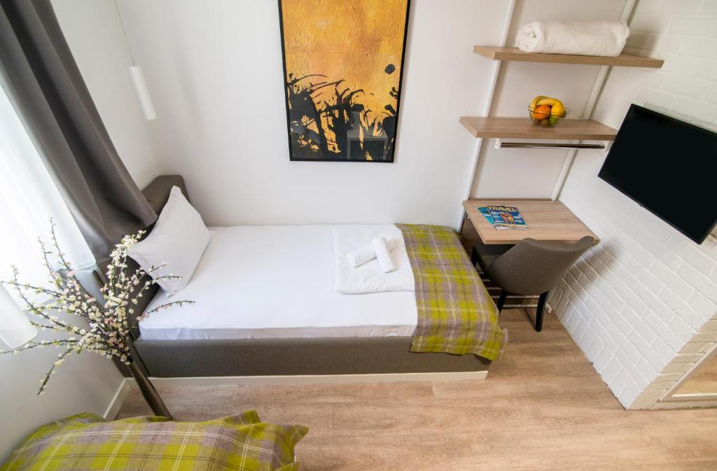 TV i/ili multimedijalni sistem u objektu Belgrade Inn Garni Hotel