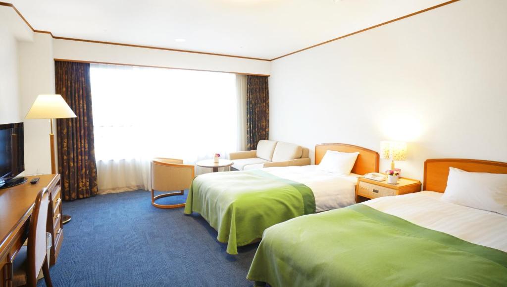 Postel nebo postele na pokoji v ubytování Hotel Laforet Nasu