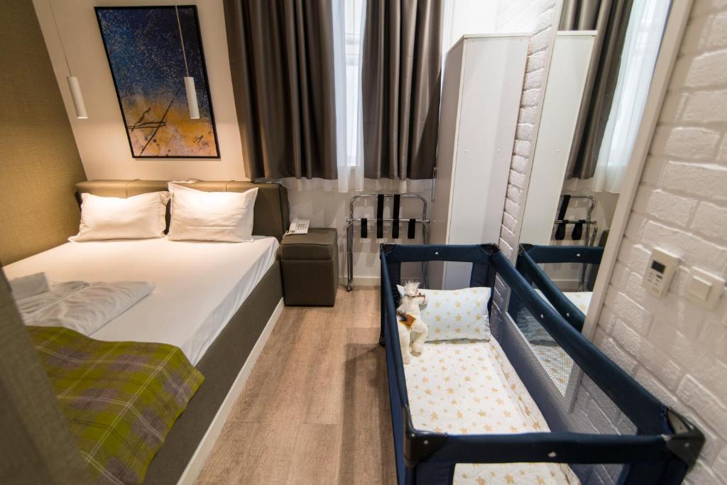 Krevet ili kreveti u jedinici u okviru objekta Belgrade Inn Garni Hotel