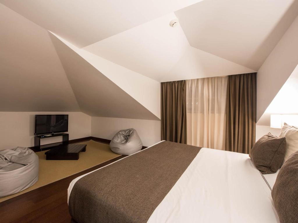 Postel nebo postele na pokoji v ubytování Hotel Carris Porto Ribeira