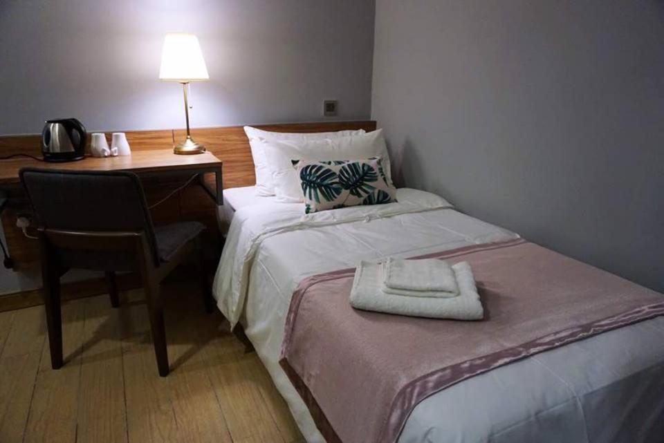 Postel nebo postele na pokoji v ubytování Hotel Gaia 95