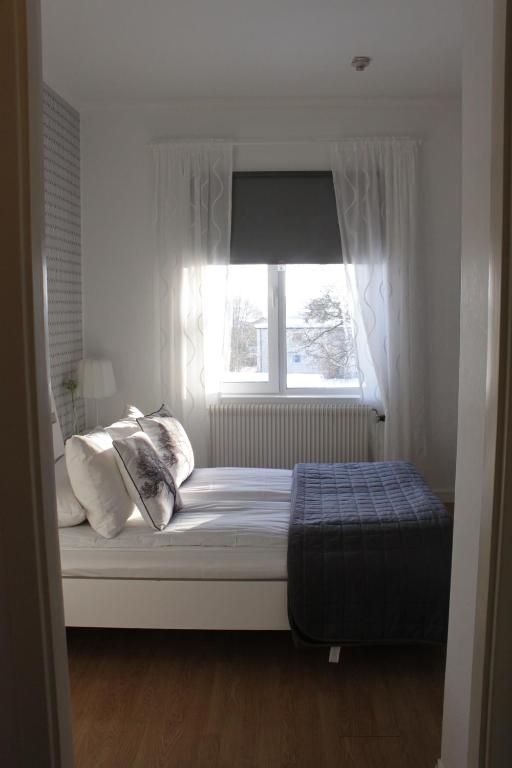 Postel nebo postele na pokoji v ubytování Hotell Björnidet