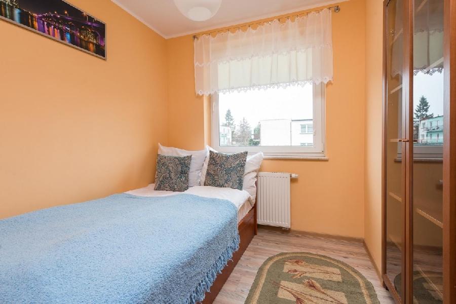 Posteľ alebo postele v izbe v ubytovaní Apartamenty Jasna