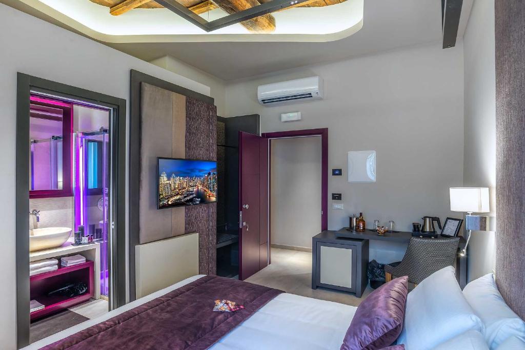Posteľ alebo postele v izbe v ubytovaní Via Veneto Prestige Rooms