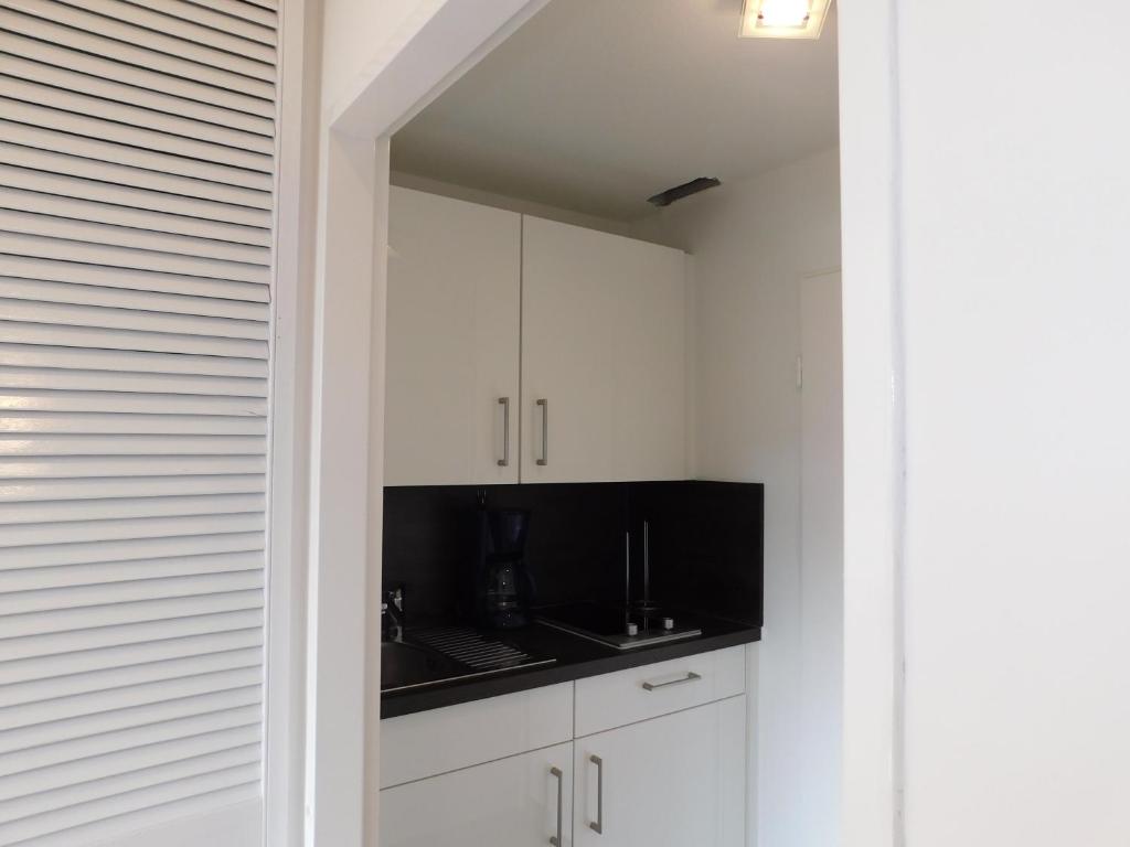 Kuchyň nebo kuchyňský kout v ubytování Wohnung Sonnenschein inkl Strandkorb vom 01 05-01 10