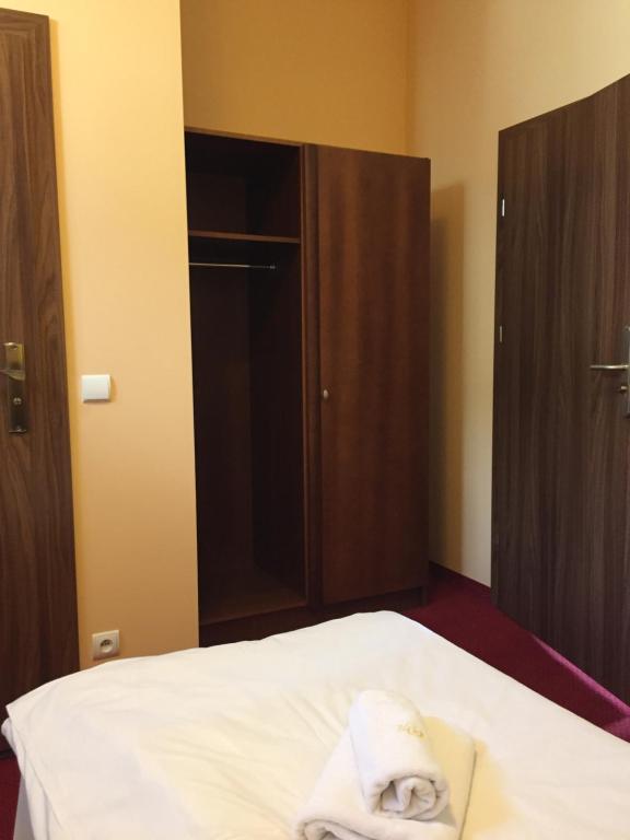 Postel nebo postele na pokoji v ubytování Virgo B&B Biznes Rumia