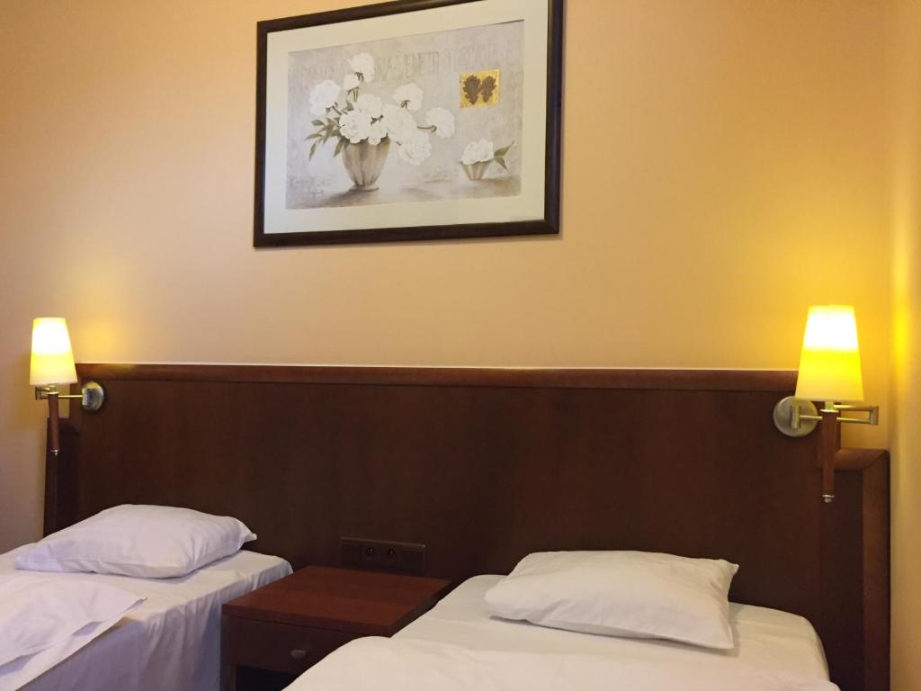 Postel nebo postele na pokoji v ubytování Virgo B&B Biznes Rumia
