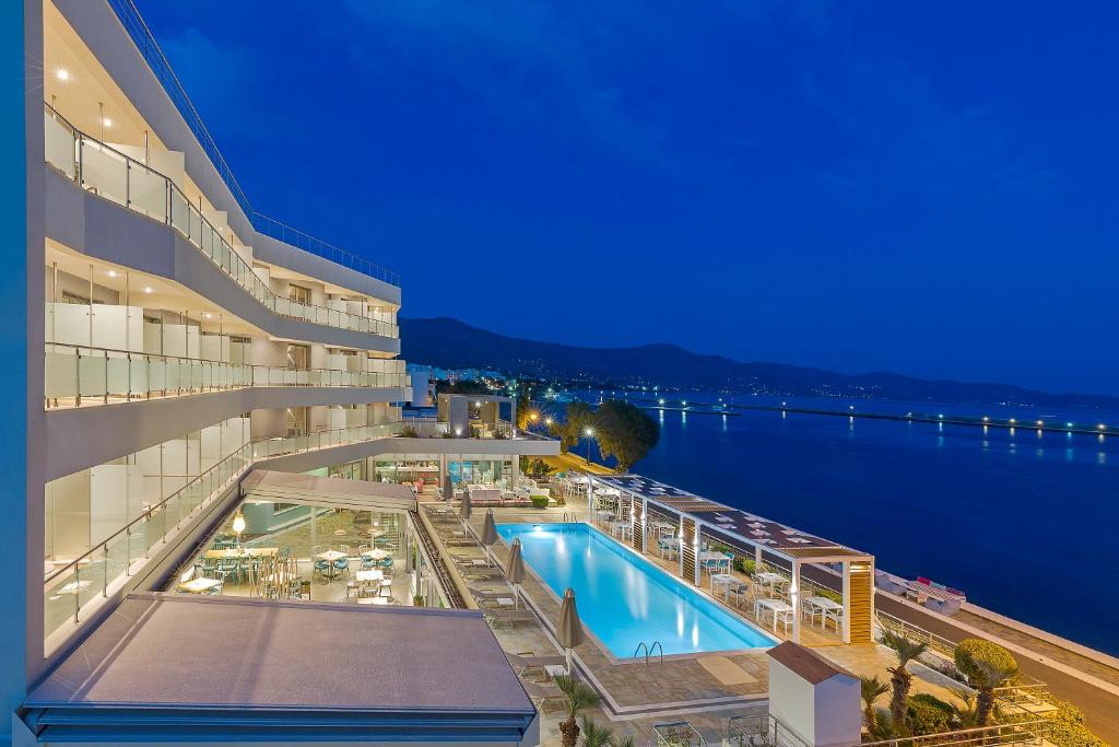 a view of a hotel with a swimming pool at Anastasia Hotel & Suites Mediterranean Comfort in Karistos