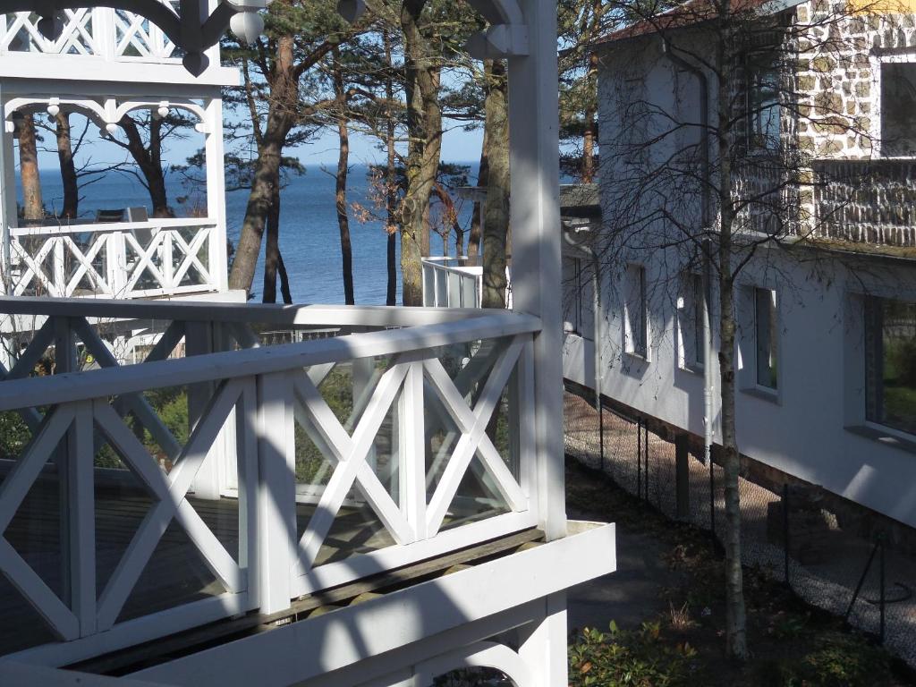 a white bridge with a view of the water at Haus Strelasund in Binz