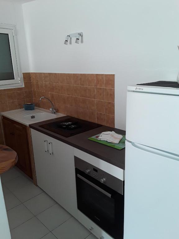 Kuchyň nebo kuchyňský kout v ubytování Camping Residence Chalet La Pomposa Terrazzoni