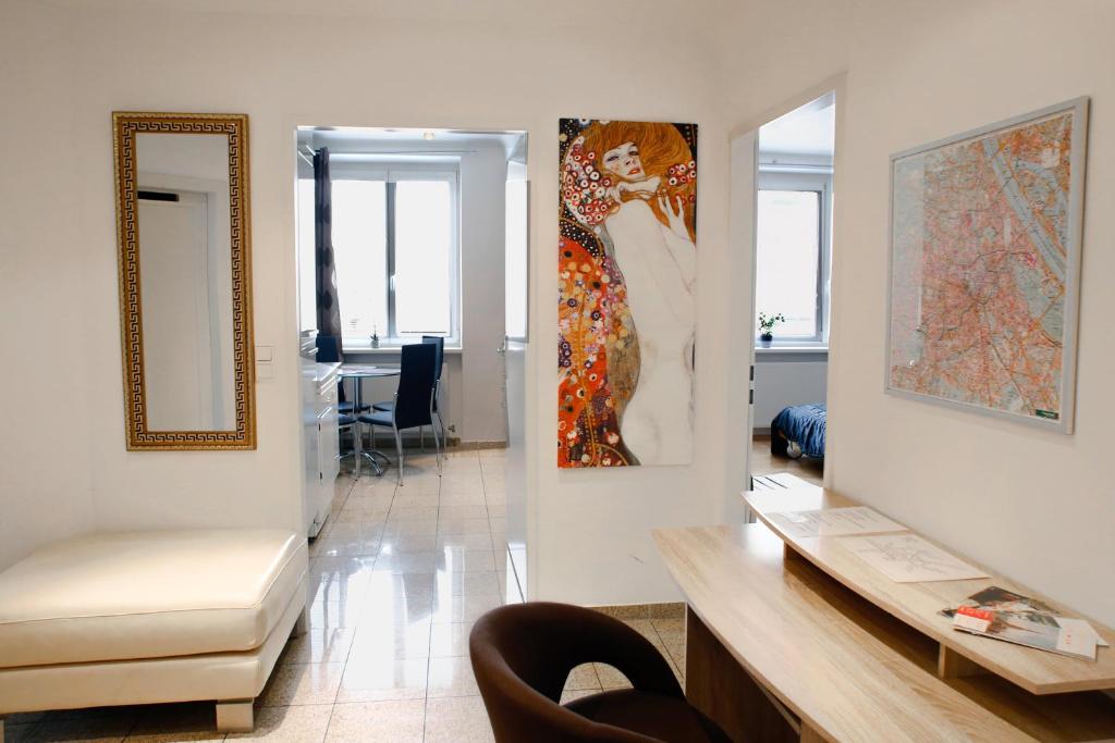 a living room with a large painting on the wall at Prestige Vienna Apartment in Vienna