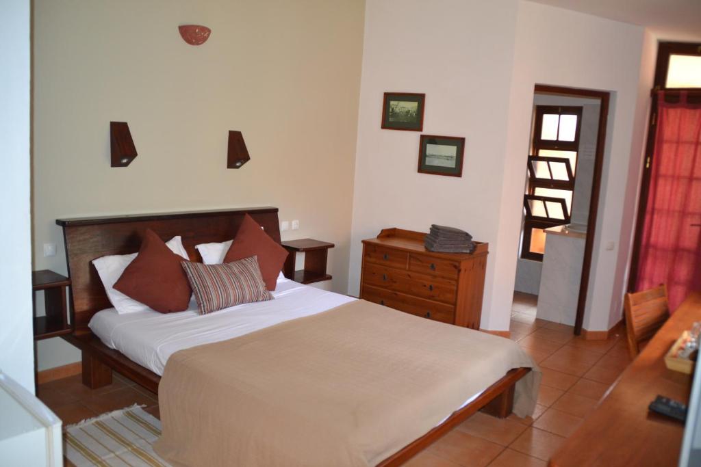 Postel nebo postele na pokoji v ubytování Guest House Orquidea