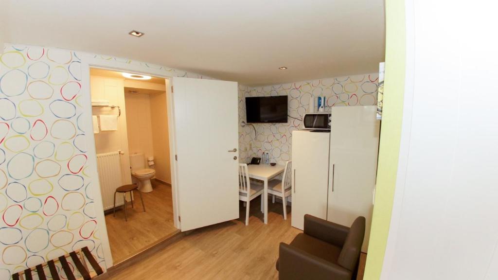 TV a/nebo společenská místnost v ubytování B&B Ter Gracht