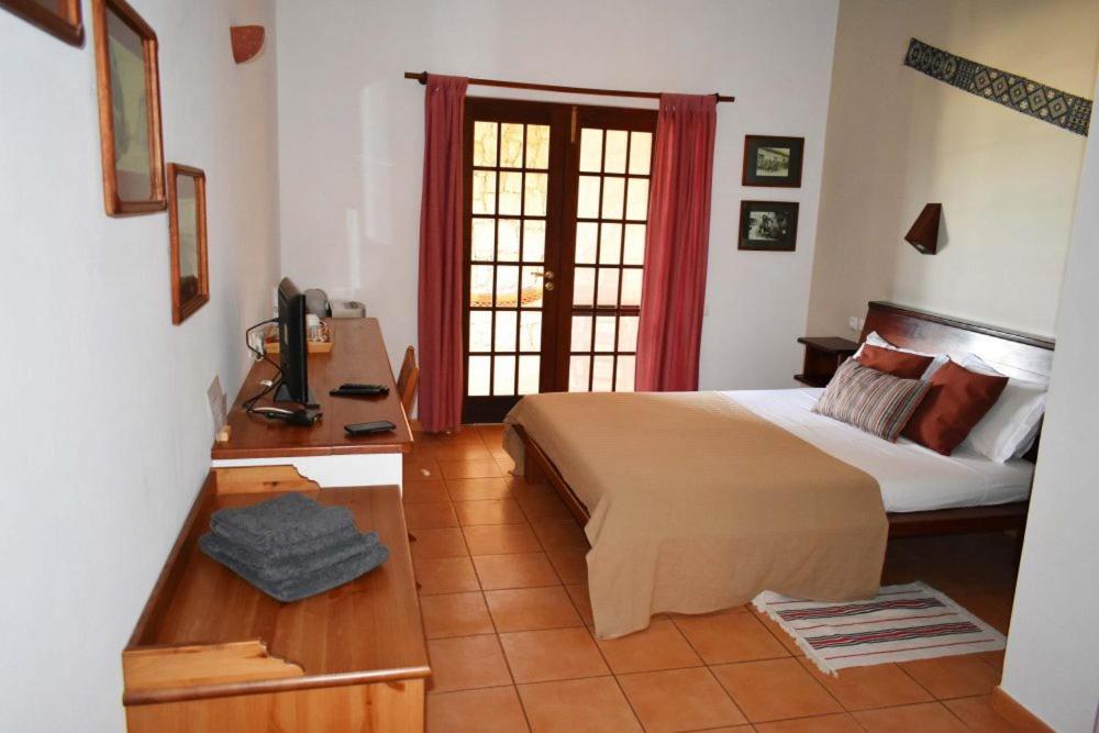 Postel nebo postele na pokoji v ubytování Guest House Orquidea
