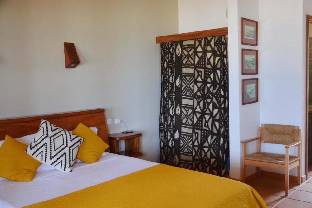 Postel nebo postele na pokoji v ubytování Guest House Orquidea