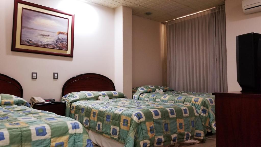 Postel nebo postele na pokoji v ubytování Hotel Ramada