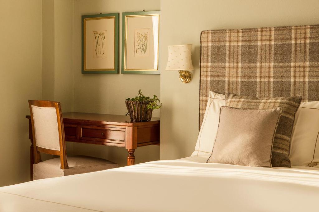 Postel nebo postele na pokoji v ubytování Corte Gondina Boutique Hotel