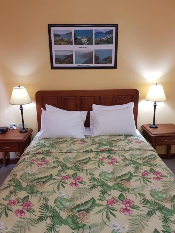 Postel nebo postele na pokoji v ubytování Piarco Village Suites