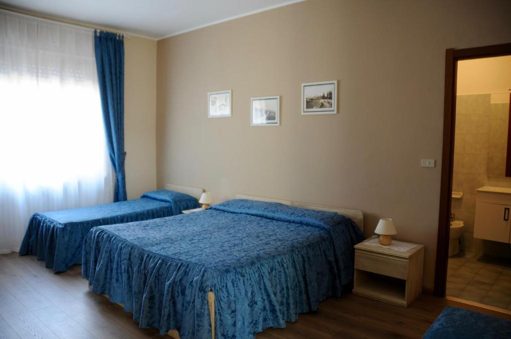 Postel nebo postele na pokoji v ubytování Albergo ristorante Da Tunon