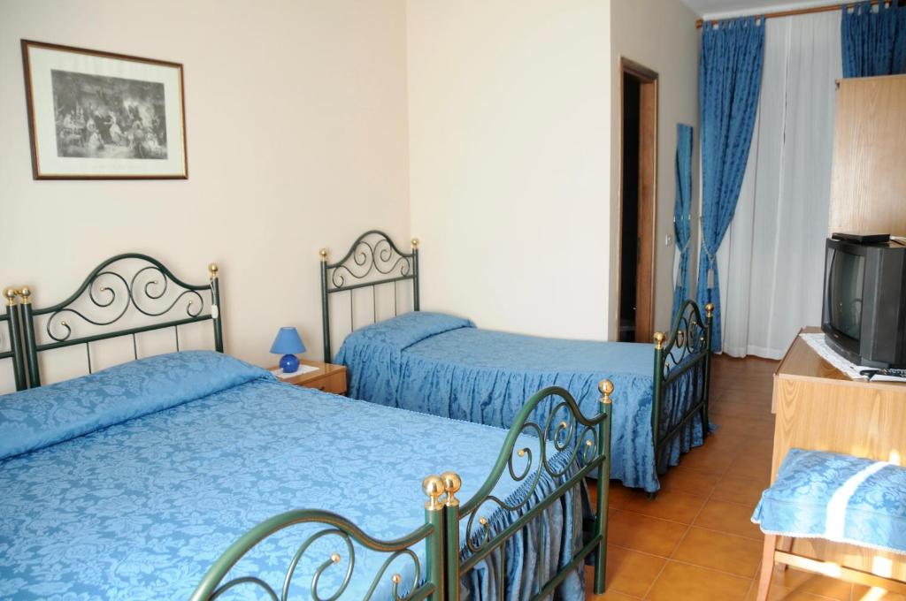 Postel nebo postele na pokoji v ubytování Albergo ristorante Da Tunon