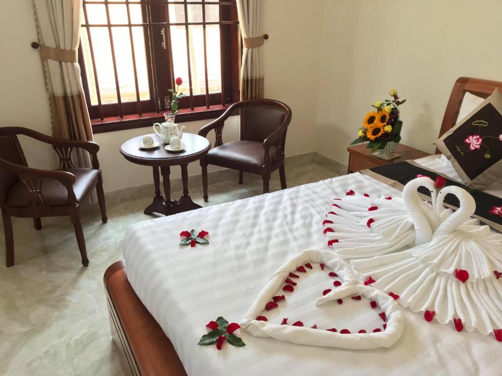 Postel nebo postele na pokoji v ubytování Hoi An Dat Cam Homestay