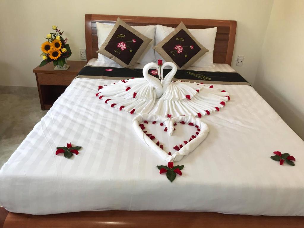 Postel nebo postele na pokoji v ubytování Hoi An Dat Cam Homestay