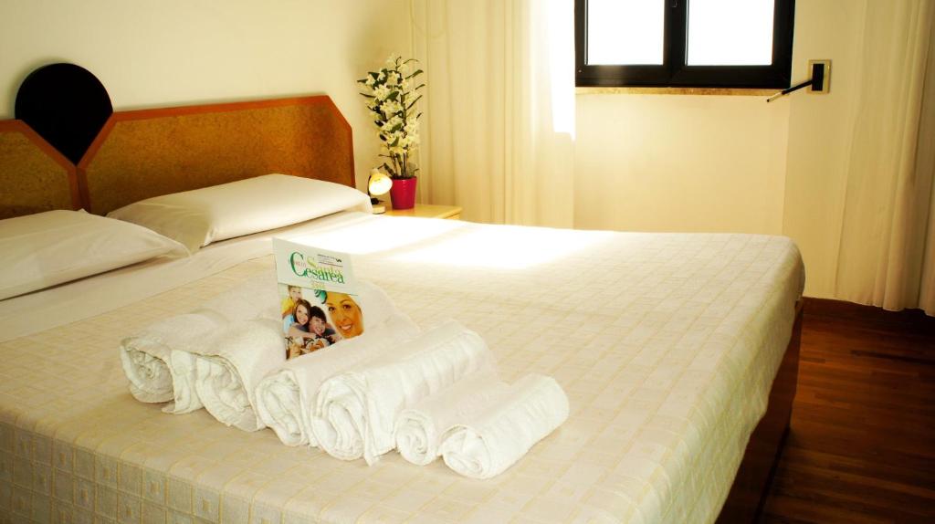 Postel nebo postele na pokoji v ubytování Albergo Palazzo