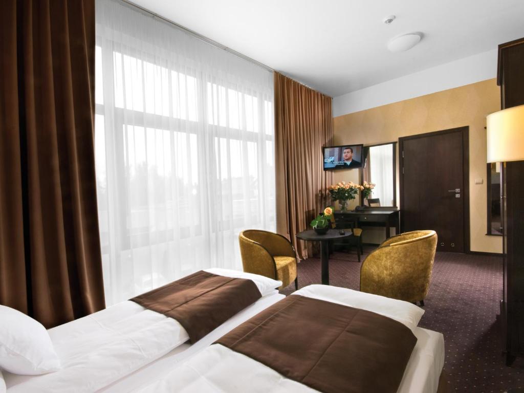 Posteľ alebo postele v izbe v ubytovaní Hotel Senator