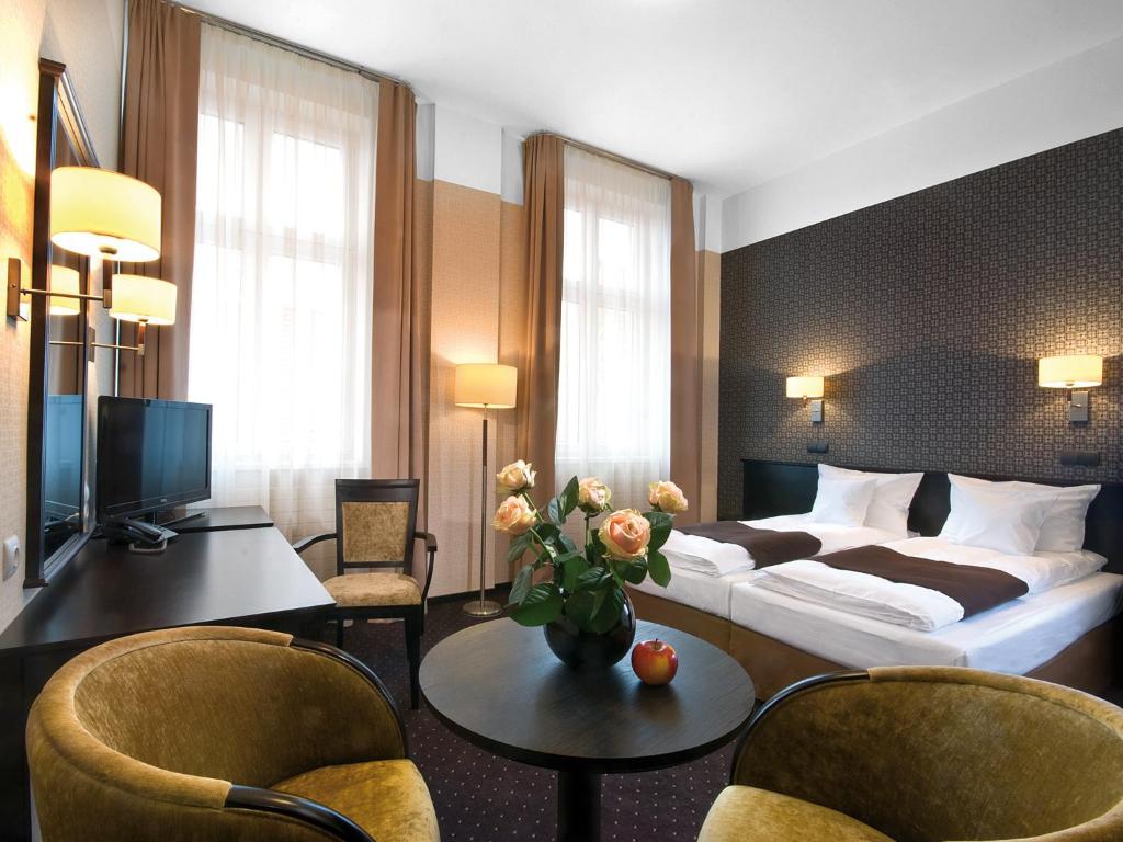 Posteľ alebo postele v izbe v ubytovaní Hotel Senator