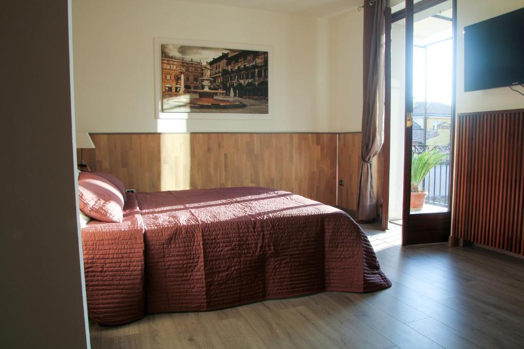 A bed or beds in a room at Palazzo Cinque Greenview