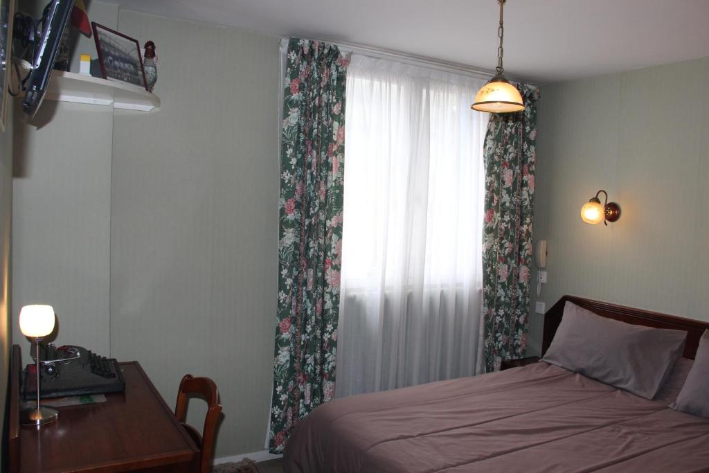 Postelja oz. postelje v sobi nastanitve Hôtel Le Catala