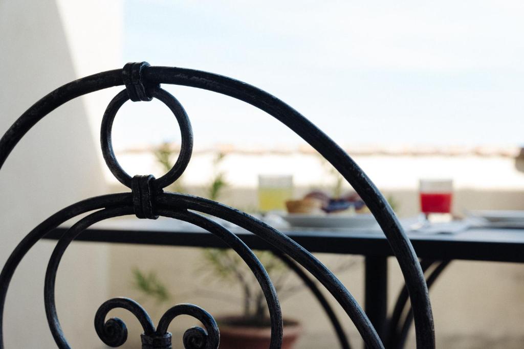 a close up of the back of a black chair at Il Castellaro in Borghi