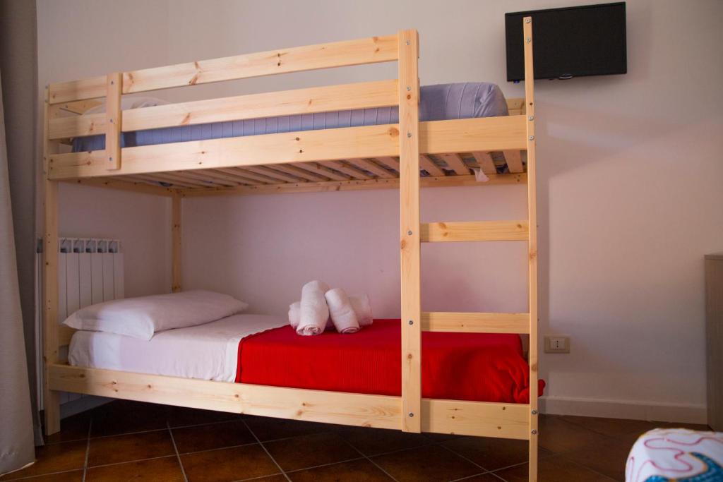 Postel nebo postele na pokoji v ubytování Casa dei Carrubi
