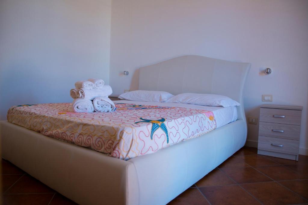 Postel nebo postele na pokoji v ubytování Casa dei Carrubi