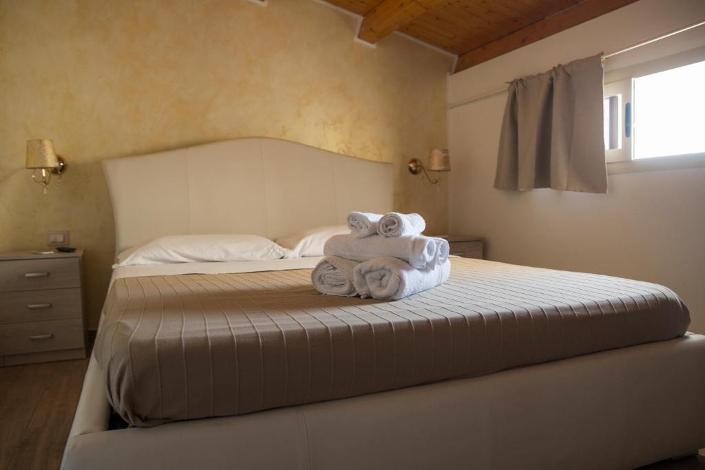 Postel nebo postele na pokoji v ubytování Casa dei Carrubi