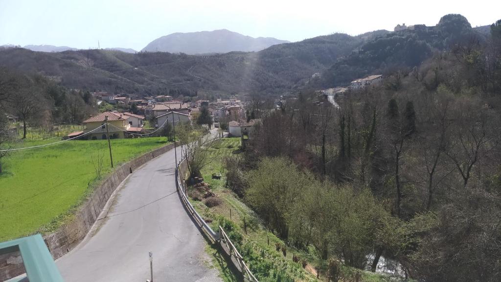 a view of a road in a valley with mountains at Palia's Hotel in Laino Borgo