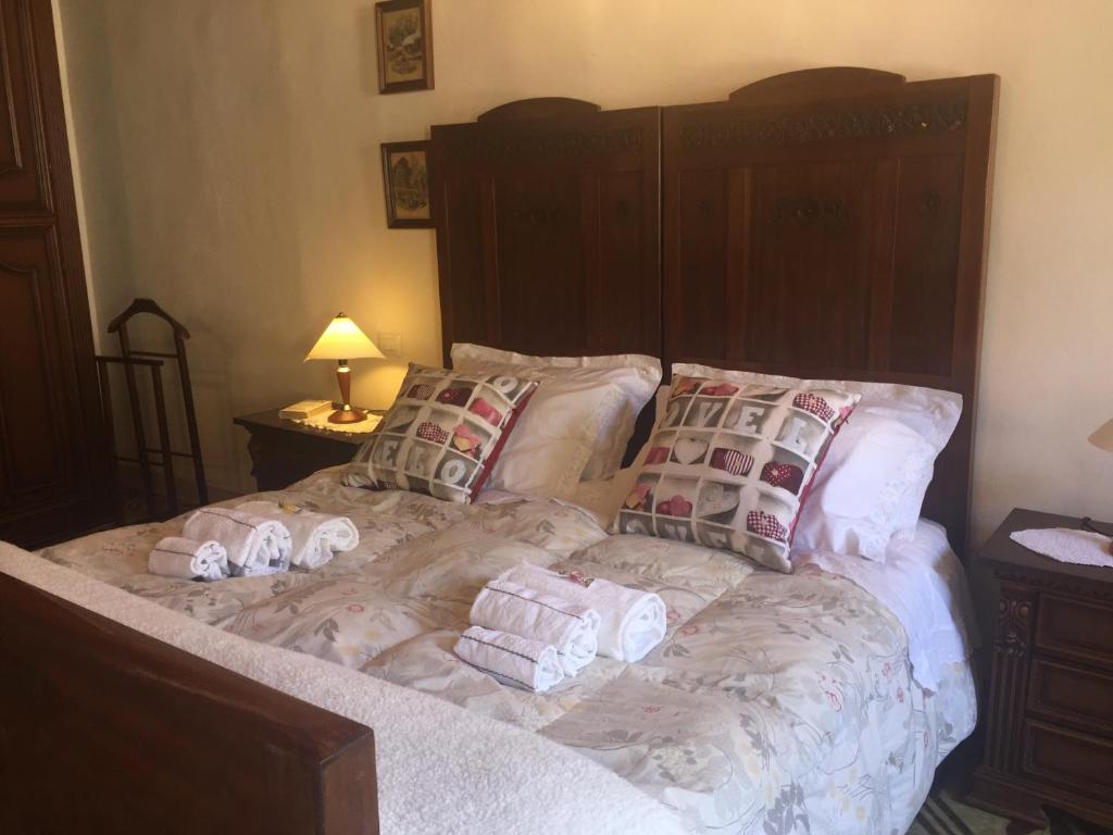 a bedroom with a bed with towels on it at La Casa di Luigi in Montevarchi