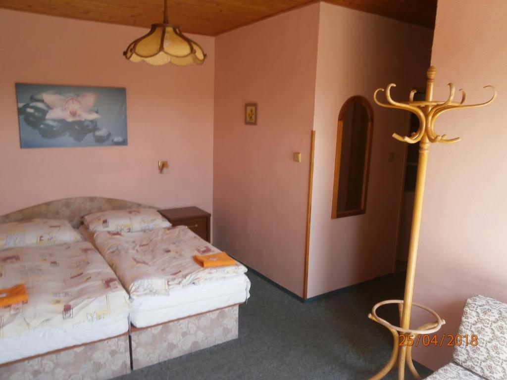 Postel nebo postele na pokoji v ubytování Penzion Oliver