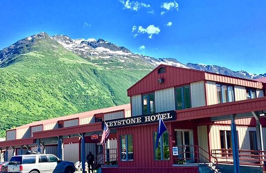 a hotel with a mountain in the background at Keystone Hotel in Valdez