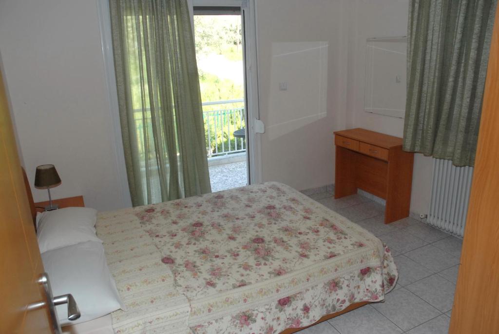 Postel nebo postele na pokoji v ubytování Anestis Apartments & rooms