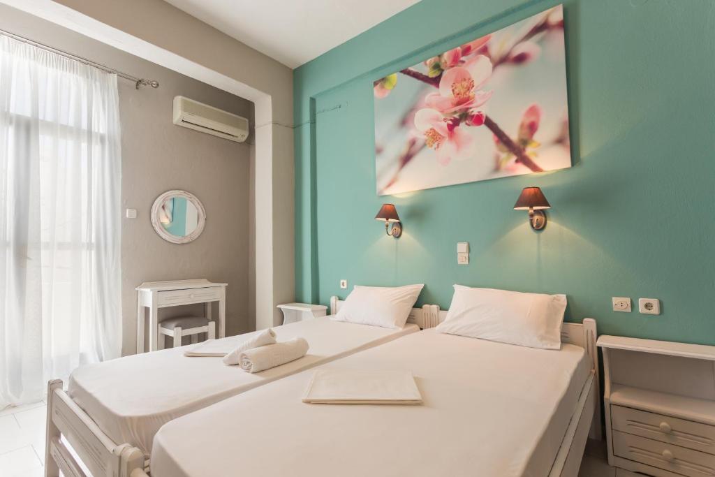 Postel nebo postele na pokoji v ubytování Protopapas Rooms